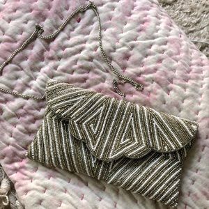 From St Xavier hand beaded clutch with optional shoulder strap